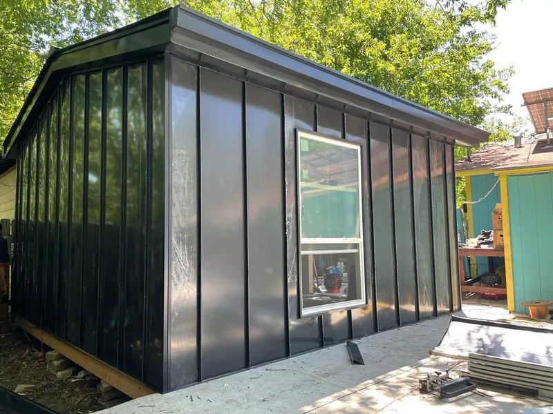 Black standing seam metal wall panels for Metal Roof Installation in London